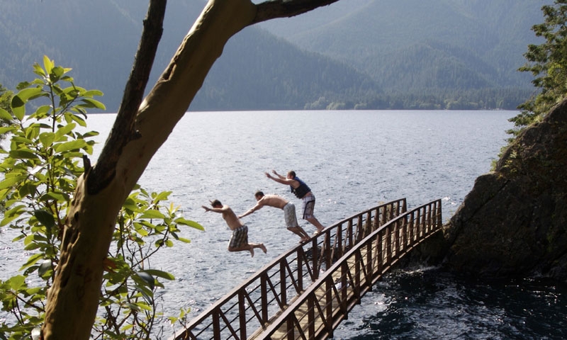 Jumping off a bridge at Lake Crescent in Olympic National Park